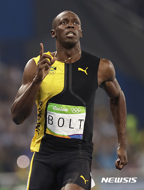 Jamaica's Usain Bolt wins the men's 100-meter final during the athletics competitions of the 2016 Summer Olympics at the Olympic stadium in Rio de Janeiro, Brazil, Sunday, Aug. 14, 2016. (AP Photo/David J. Phillip)