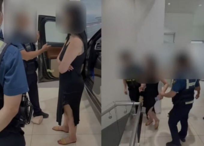 한 여성이 서울의 수입차 전시장 차량에 올라타 담배를 태우고 물건을 던지는 등 난동을 피워 경찰이 출동했다. /사진=유튜브=뉴스1