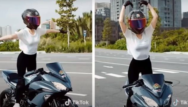 베트남의 한 여성 모델이 양손을 핸들에서 뗀 채로 오토바이를 타는 등 곡예 운전하는 모습이 공개됐다./사진=틱톡