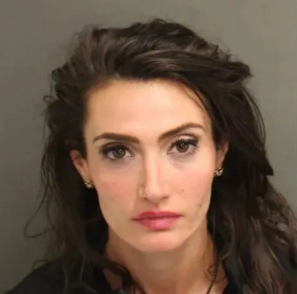 Amber Flora's mug shot. /Photo=Amber Flora's social media
