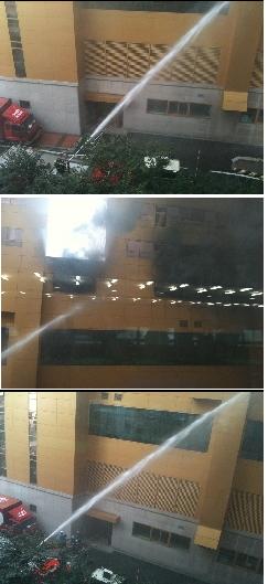 ↑건물뒷편에서 방수포를 통해 화재 진압 중인 모습