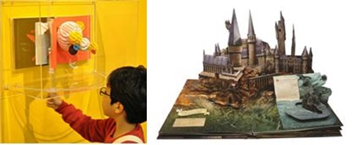 서울 예술의전당 한가람미술관에서 열리고 있는 '세계팝업아트'전시에서 한 어린이가 작품을 직접 당겨보면서 관람하고 있다.