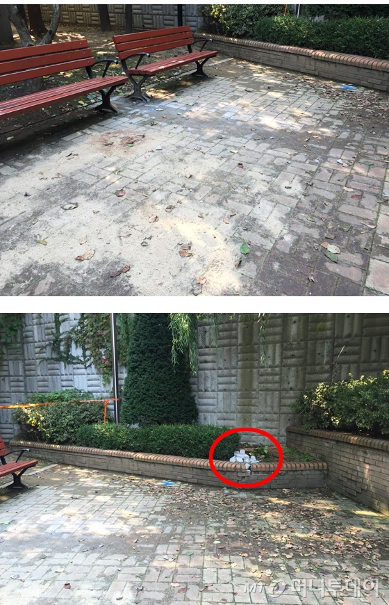 아파트 단지 내 화단에서 고양이집을 만들던 50대 여성이 초등학교 학생들이 떨어뜨린 벽돌에 맞아 사망한 이른바 '용인 캣맘 사건' 현장에 폴리스 라인이 설치돼 있다. 박모씨(55)는 이 곳(벤치)에서 고양이집을 만들다 벽돌에 맞아 사망했다. 사건에 사용된 것으로 보이는 벽돌(붉은 원 안). / 사진 = 이재윤 기자