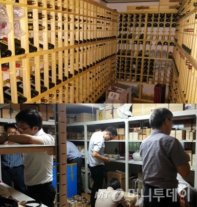 유령 해외법인을 만들어 국내 호화주택을 취득한 상습체납자의 주택에서 국세청 조사관들이 1500여명의 와인과 명품가방 등을 압류하고 있다/ 사진=국세청