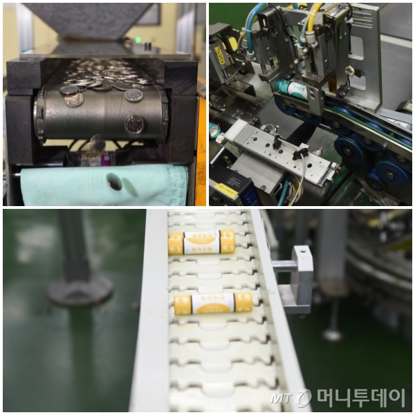 프레스기를 거친 동전이 자동화 포장단계를 거치고 있다/사진제공=조폐공사