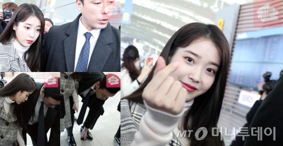 가수 아이유가 '구찌 2020년 가을-겨울 여성 패션쇼' 참석을 위해 이탈리아로 18일 오후 인천국제공항을 통해 출국하고 있다. 출국장으로 향하는 아이유가 경호원과 함께 팬이 떨어뜨린 물건을 주워주는 훈훈한 모습이 포착 됐다. / 사진=임성균 기자 tjdrbs23@