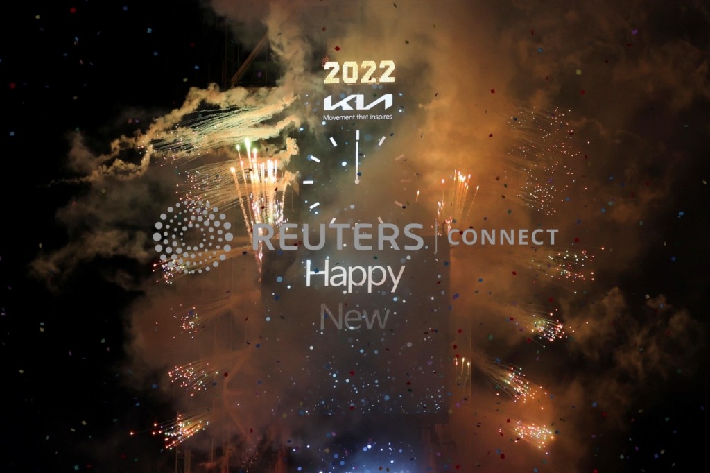 Fireworks are seen as the clock announces the New Year in Times Square, as the Omicron coronavirus variant continues to spread, in the Manhattan borough of New York City, U.S., January 1, 2022. REUTERS/Hannah Beier
