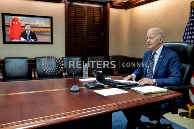 U.S. President Joe Biden holds virtual talks with Chinese President Xi Jinping from the Situation Room at the White House in Washington, U.S., March 18, 2022. The White House/Handout via REUTERS. 