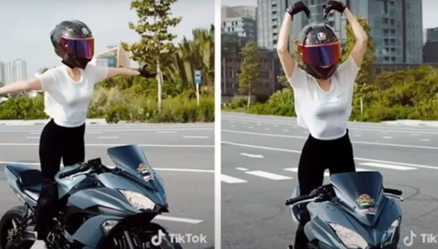 베트남의 한 여성 모델이 양손을 핸들에서 뗀 채로 오토바이를 타는 등 곡예 운전하는 모습이 공개됐다./사진=틱톡