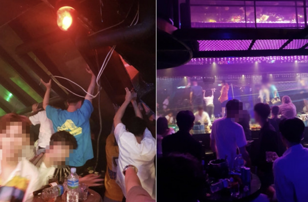 광주 나이트클럽에서 사고가 발생하자 이들을 구하기 위해 시민들이 구조물을 들어 올리고 있다. 