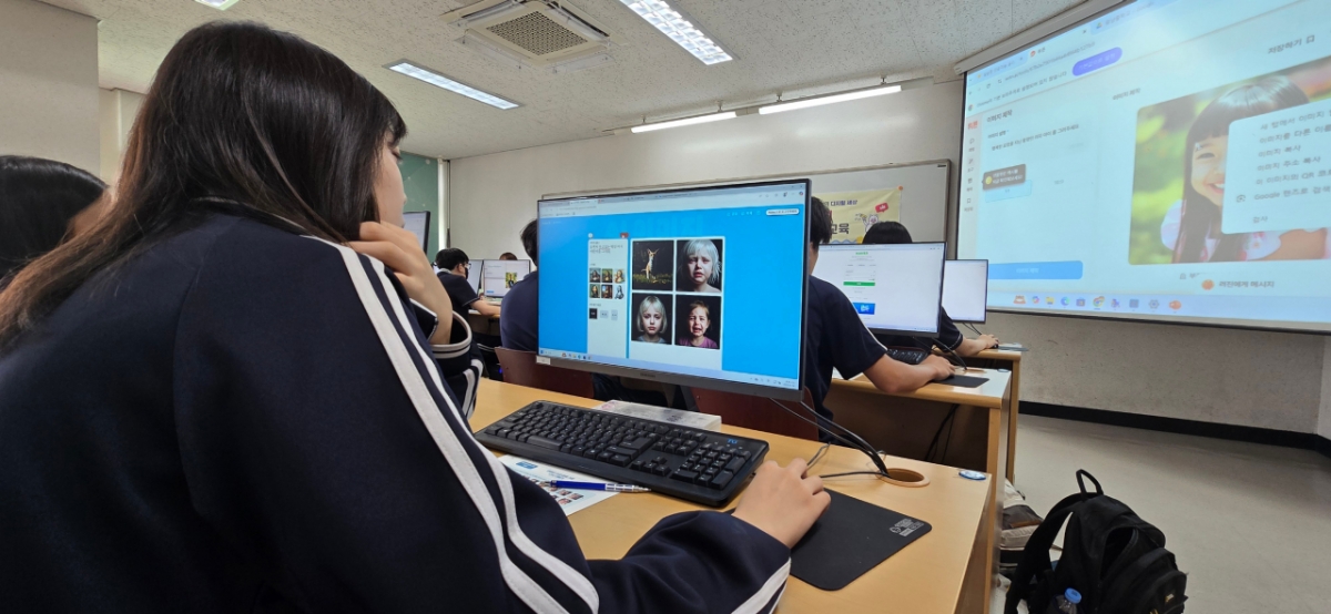 방송통신위원회와 한국지능정보사회진흥원(NIA) 주관으로 진행된 광남중 디지털 윤리 교육에서 한 학생들이 교육자료에서 제시된 사진들을 통해 '행복한 표정'과 '행복하지 않은 표정'을 구분하고 있다. / 사진=황국상 기자
