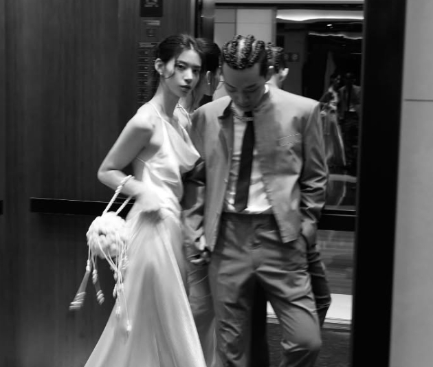 Rapper Yang Hong-won drew attention for calling out the name of his wife, Won Hyeon-ju, on stage during a performance, as he was embroiled in infidelity suspicions shortly after his marriage. /Photo=Screenshot from social media