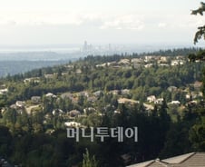 美·加 '서브프라임 무풍지대'를 가다