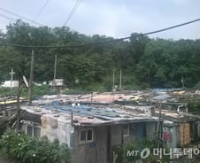 [단독]구룡마을 주민 1400명, '개발 반대' 집단 탄원