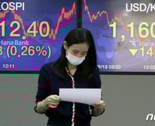 뚝 떨어진 환율…외국인 하루 만에 주식 다시 담았다